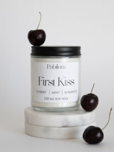 Pabilora First Kiss scented candle in a glass jar with wild mint and cherry.