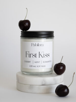 Pabilora First Kiss scented candle in a glass jar with wild mint and cherry.